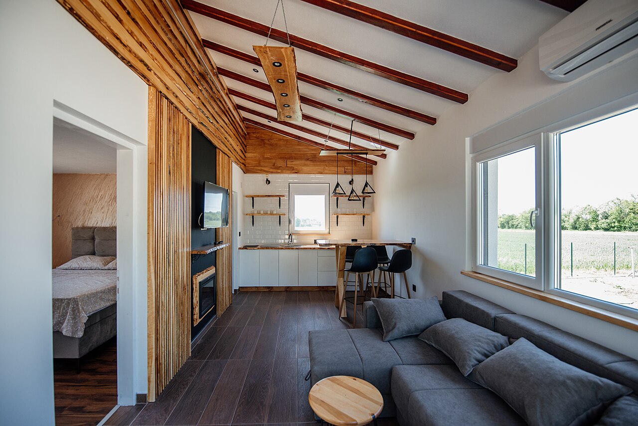 Open plan living area with large windows and clear walkways