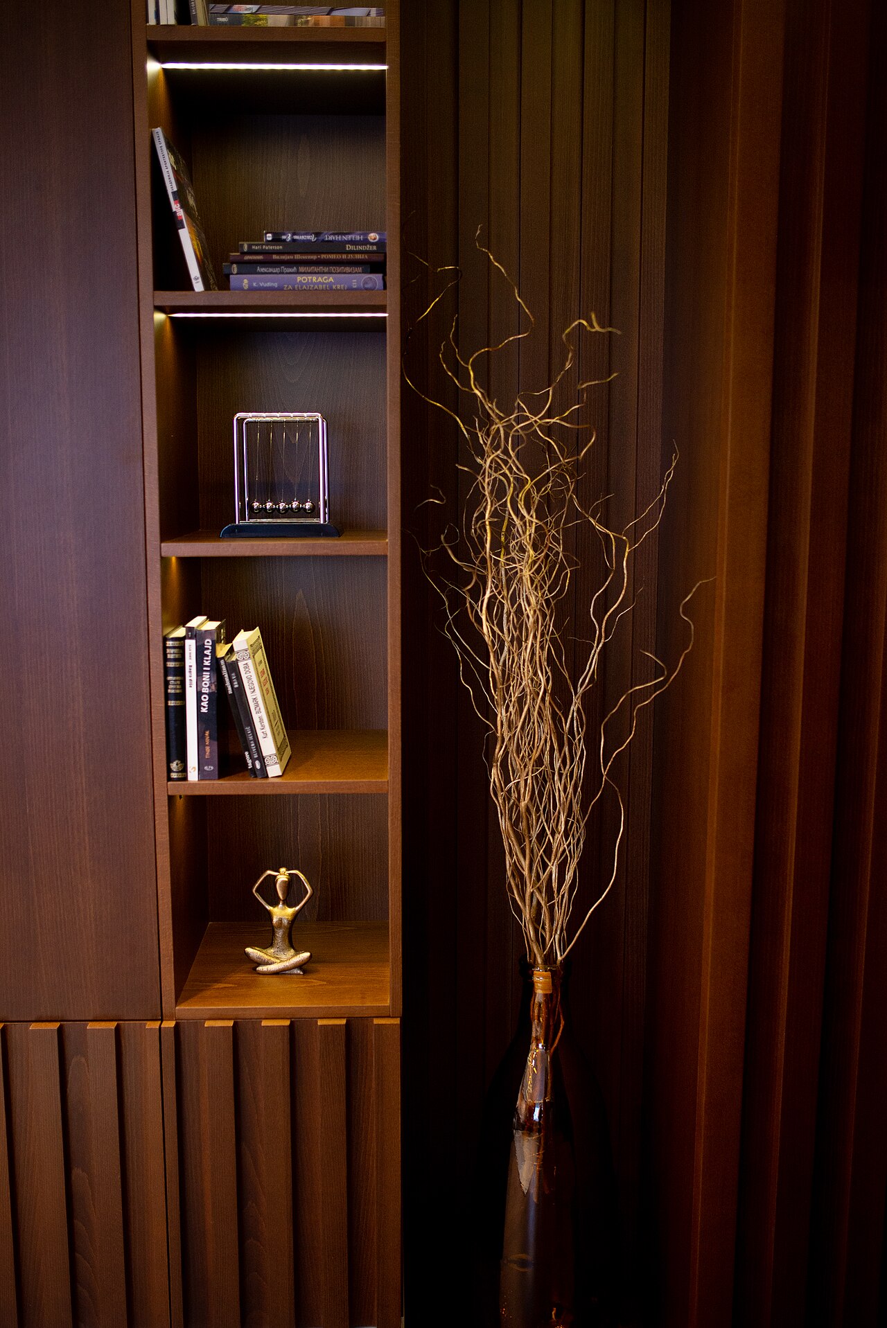 Wood shelving with a tidy display of home items and books